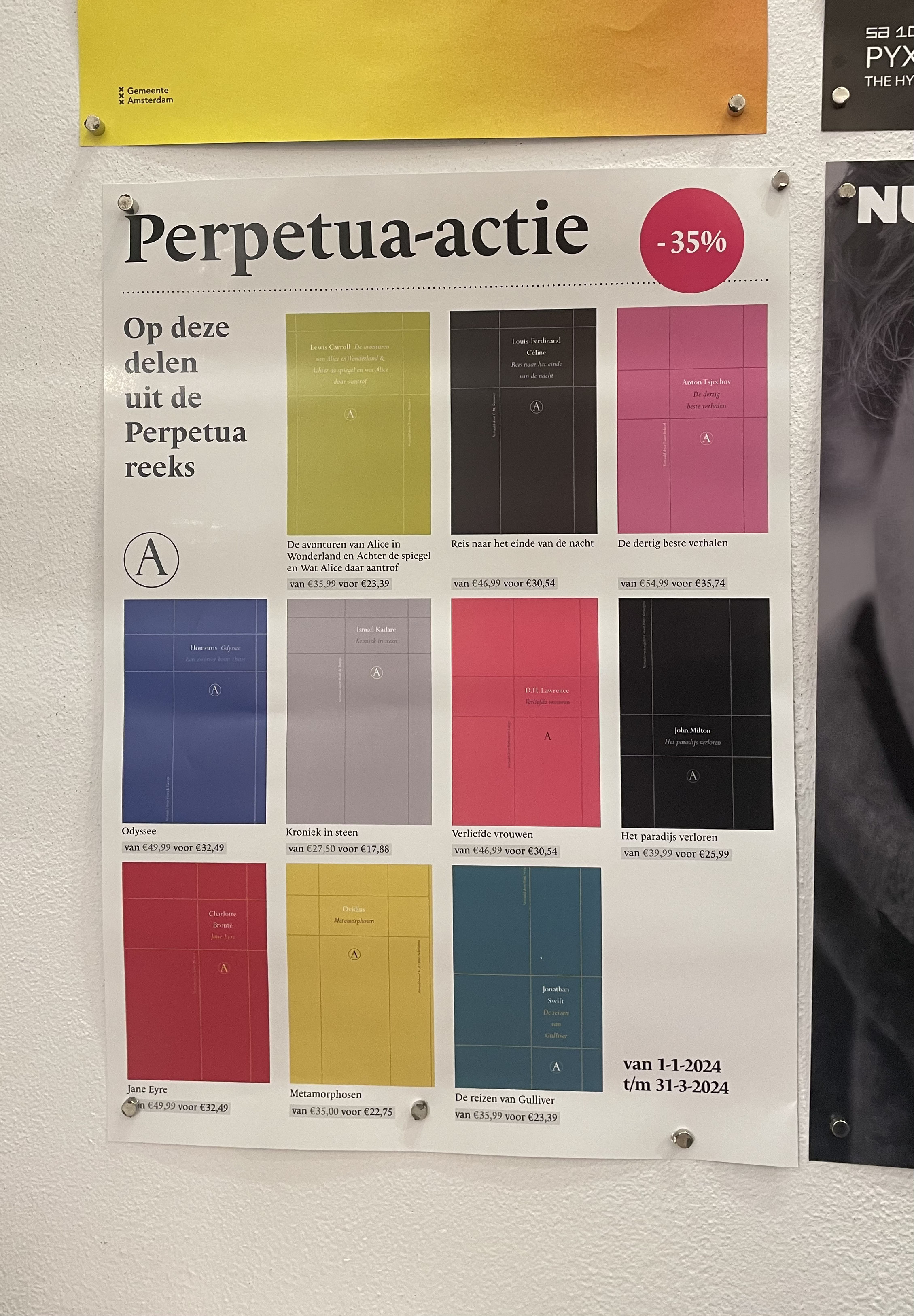 Perpetua-actie poster pinned to a wall at Athenaeum bookstore.