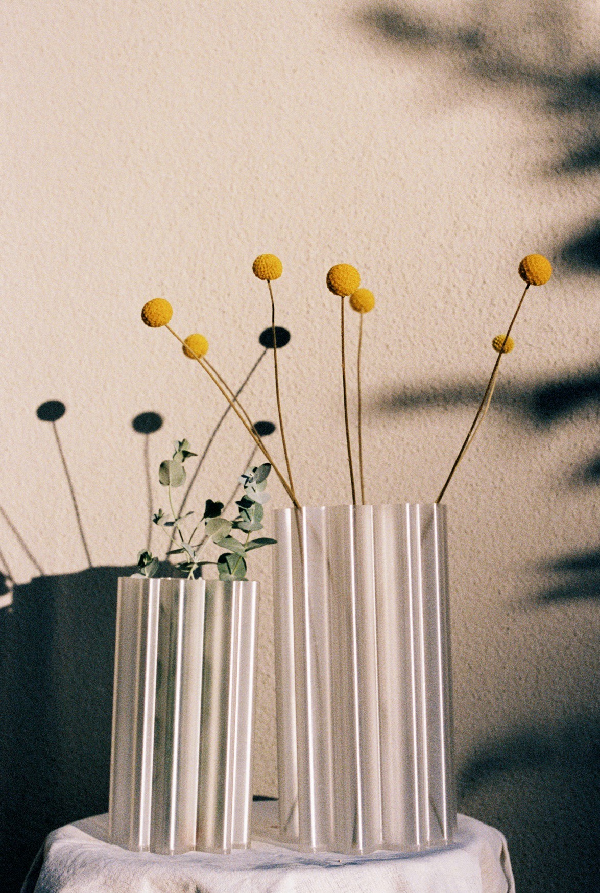 Small fluted vase with dried flowers.