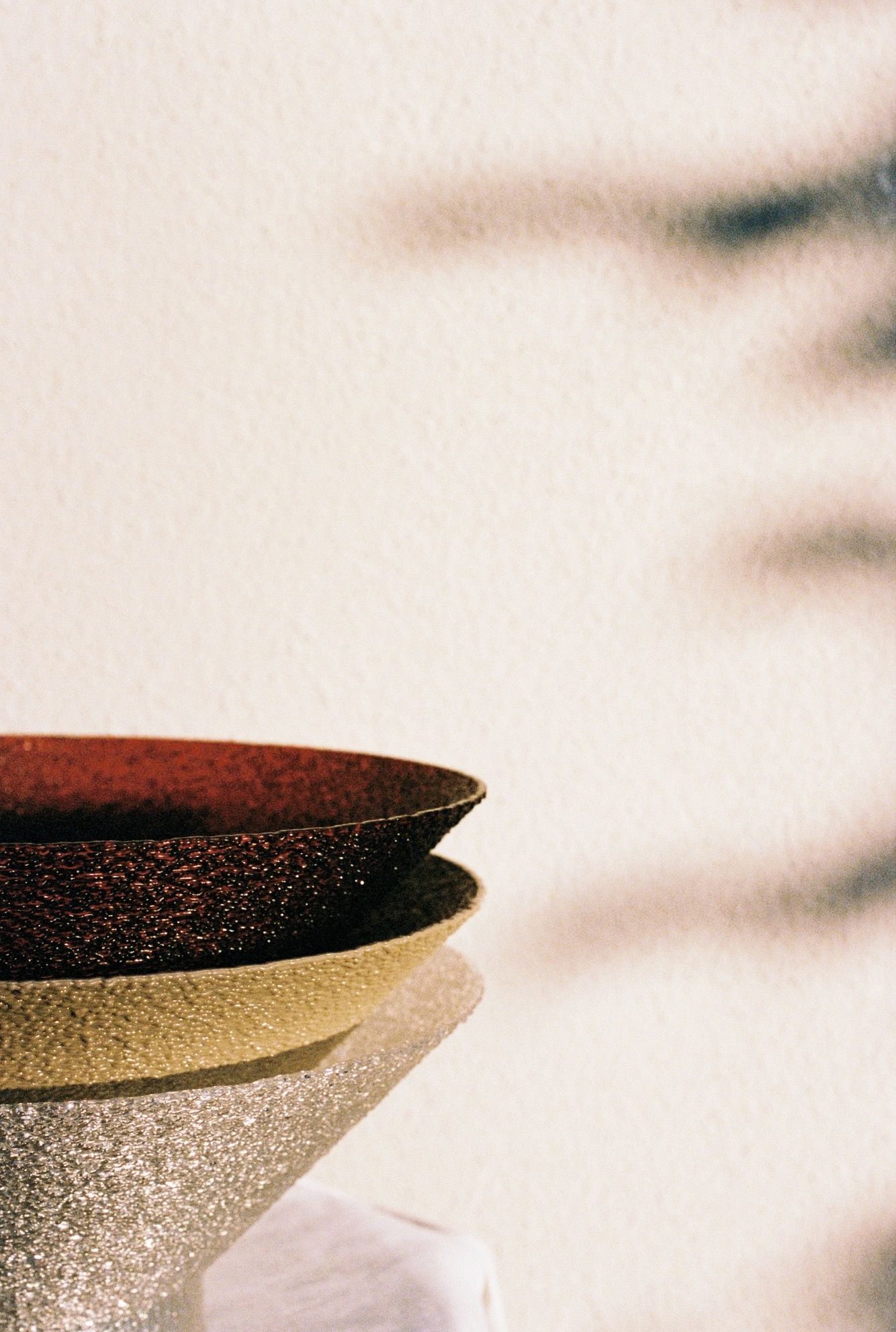 Close-up of stacked ceramic bowl rims.