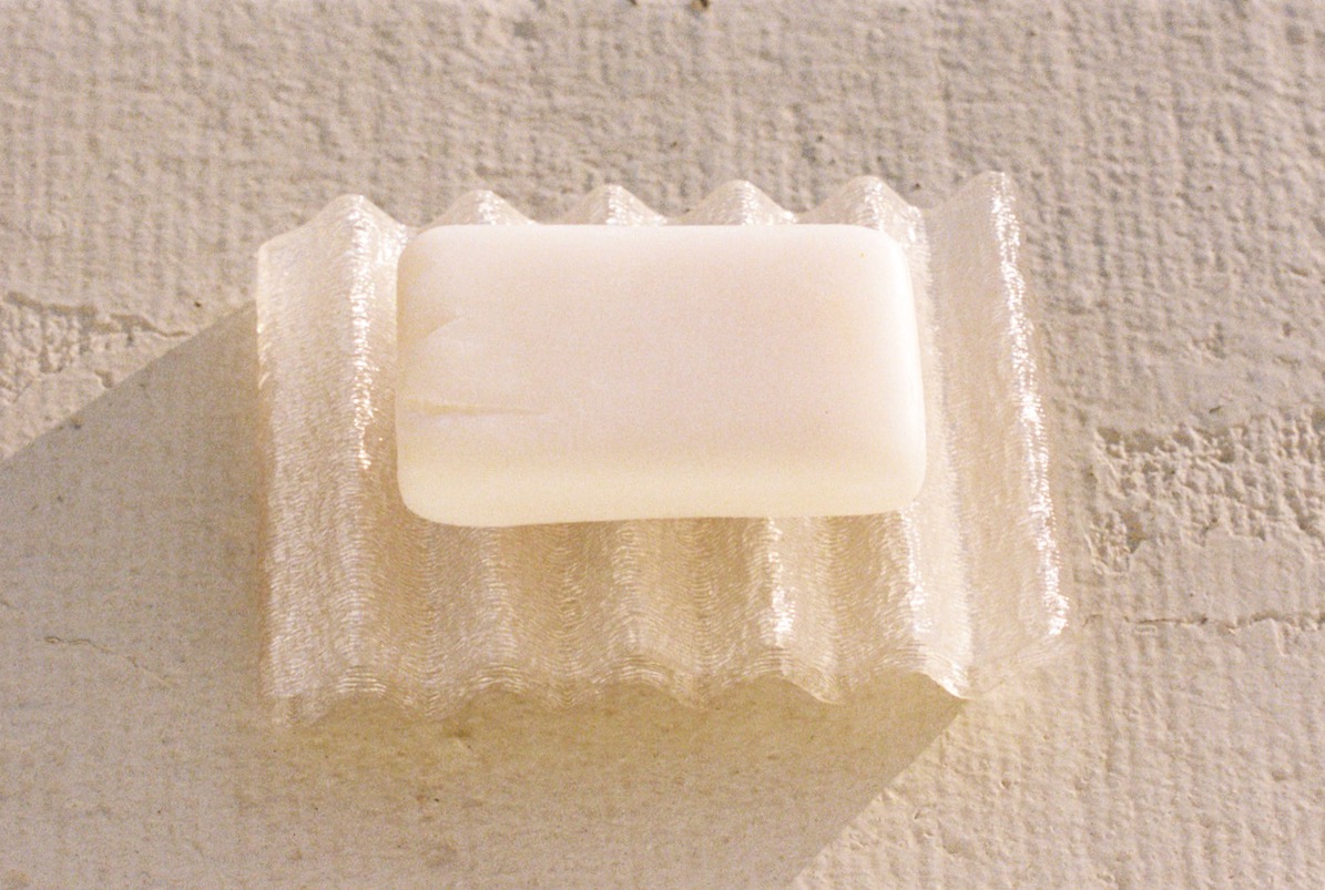 3D-printed soap dish on a wall.