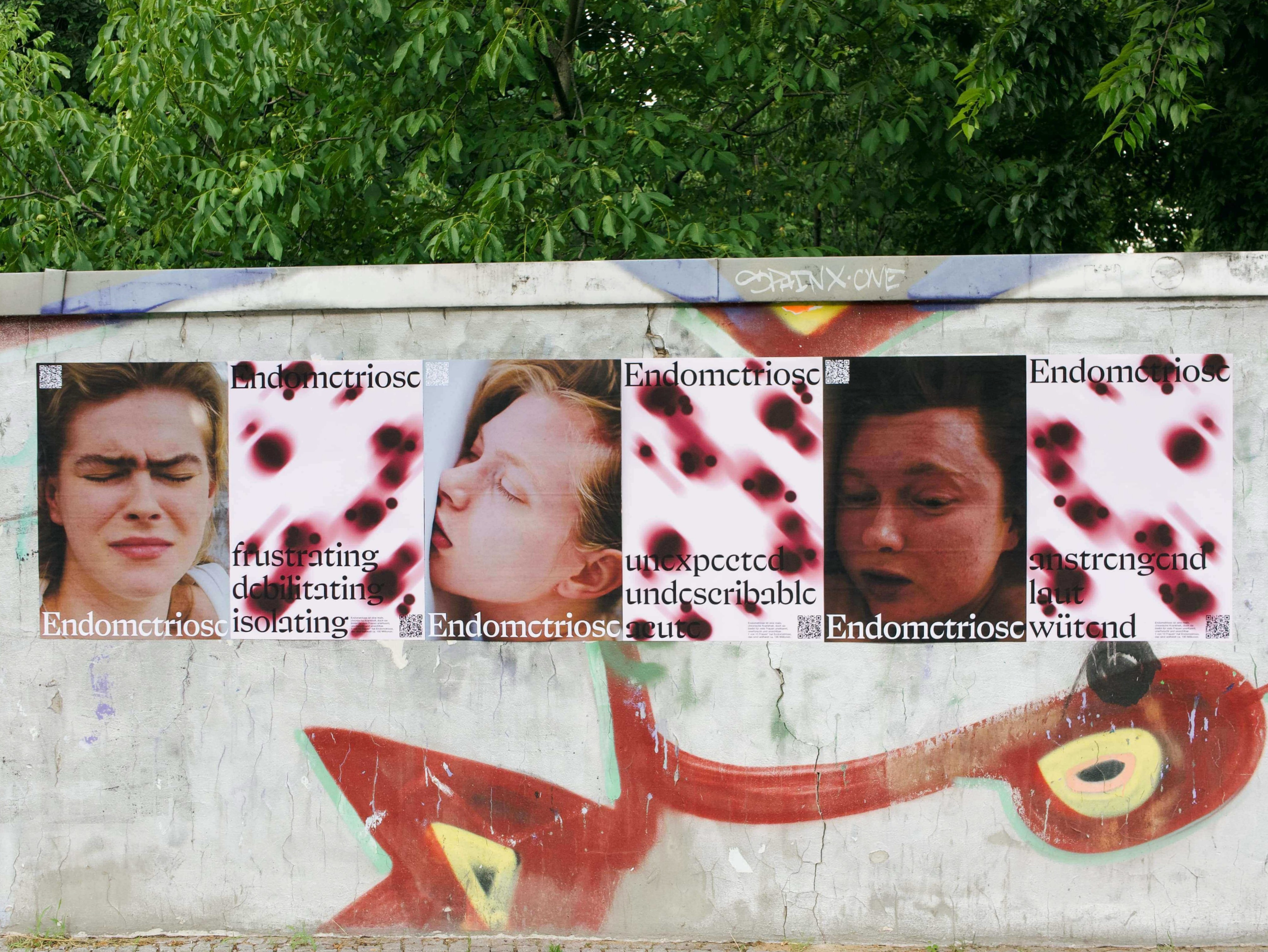 Installation view of Pain Is Not Normal posters.